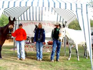 Zone 5 Trail Challenge Non-Pro Sheila Cross and Zone 5 Trail Challenge Pro Tim Cross with Director Julee Smith. Tim and Sheila, from T Cross Farm in Chariton, Iowa, traveled the farthest distance to attend the trail ride.